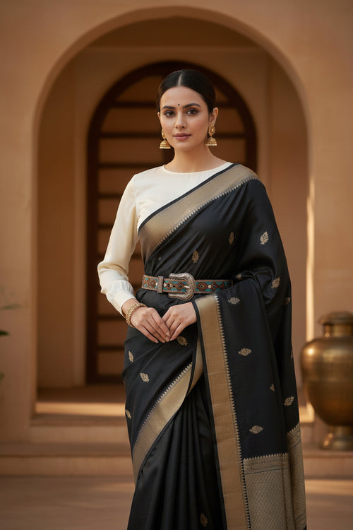 #Fusion #Woman in a #black Indian traditional #Saree with #handcarved #leather belt.